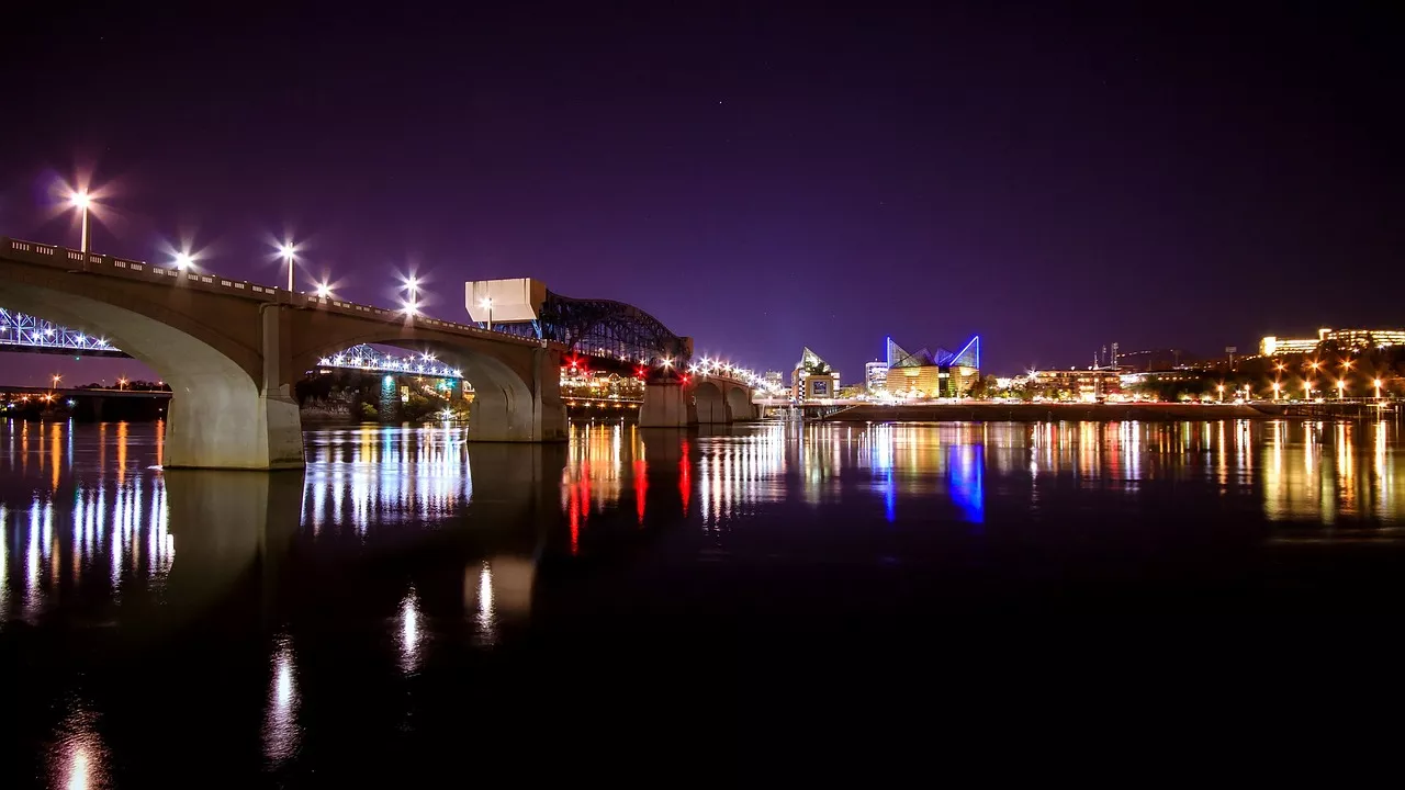 Chattanooga cityscape at night with lights reflecting on the Tennessee River